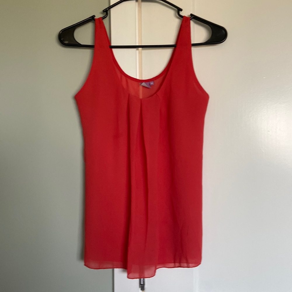 Sleeveless top, salmon color, chiffon like fabric, pleats detail front, fit…